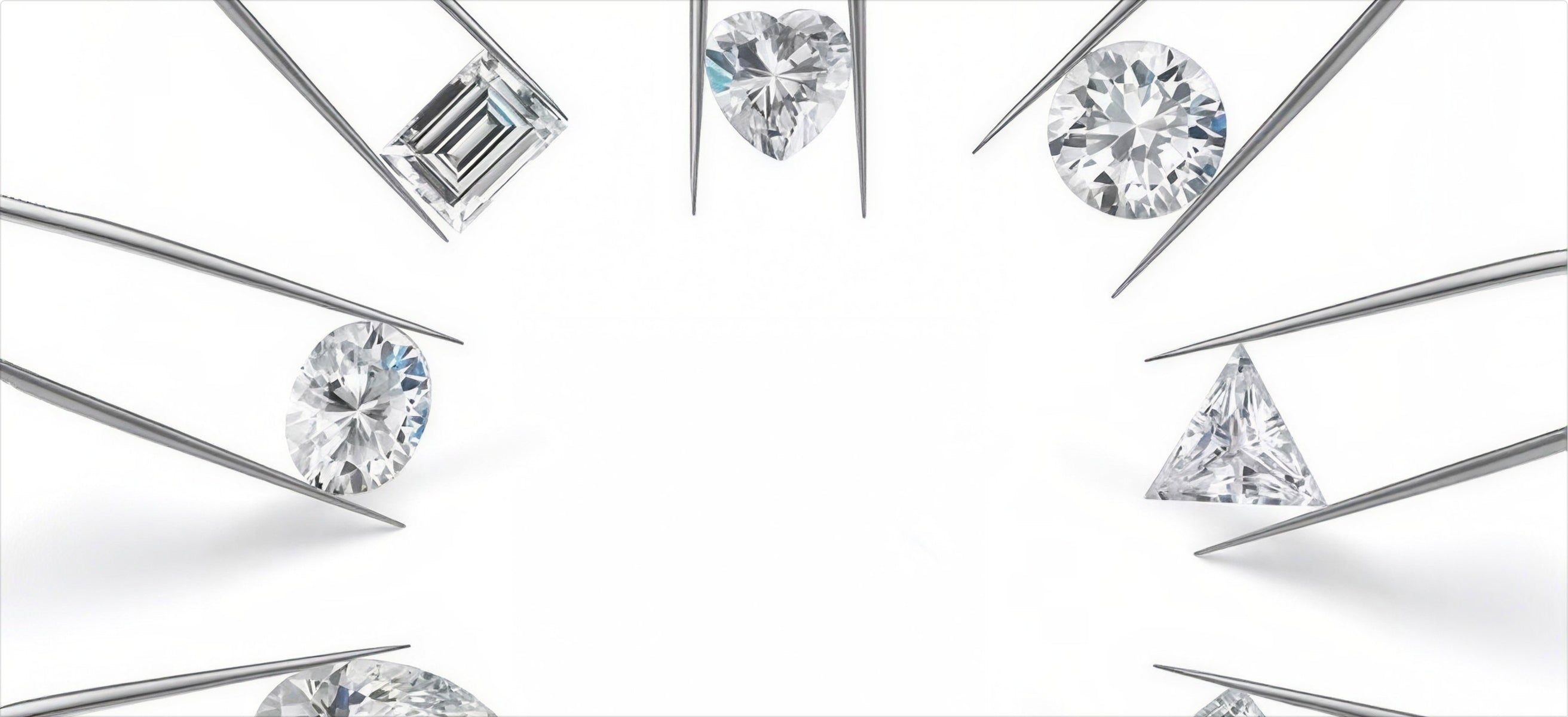 Loose diamonds of different shapes held in tweezers